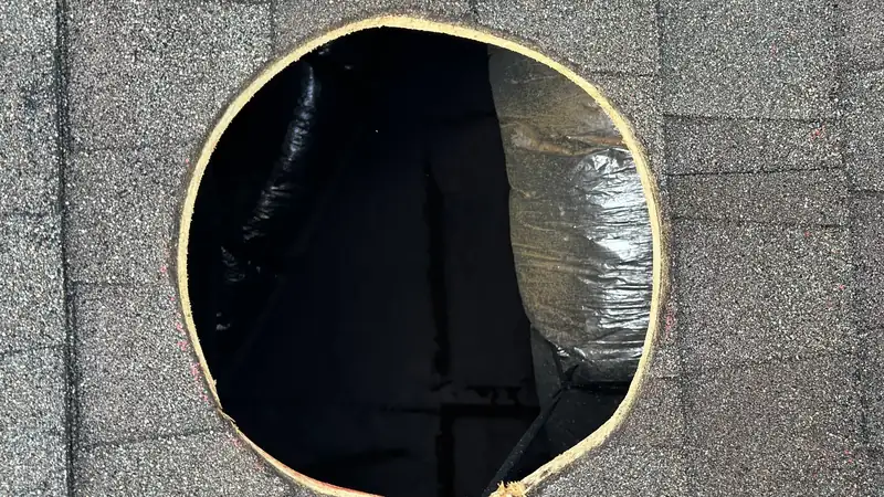 Roof opening sealed with membrane before the fan housing is set